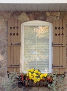 Arched Top Board and Batten Shutters with Diamond Cutouts