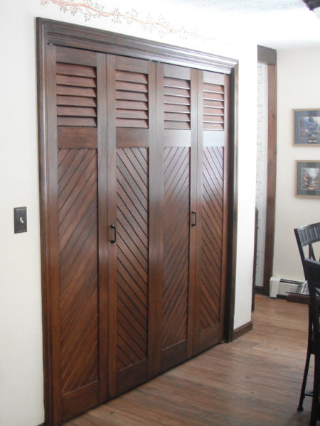 European fixed louvers over tongue and groove shutters used as doors