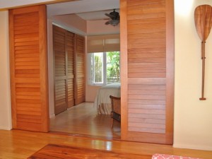 Fixed louver sliding doors made with Mahogany stave core stiles and rails