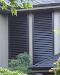 Fixed louvered shutters give the illusion of windows